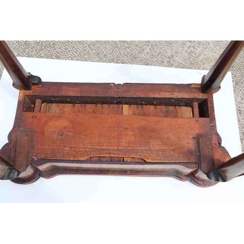 749 - A George III mahogany card table on turned legs terminating in pad feet, 84cms wide.