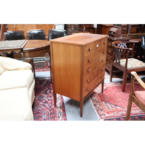 753 - A mid 20th century teak chest in the manner of Heal's with an arrangement of five long drawers, on t... 