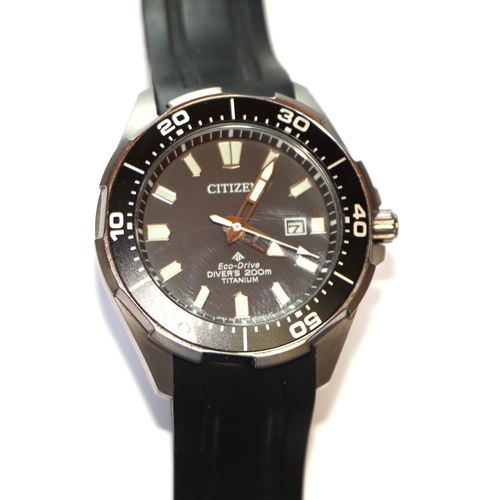 417A - A Citizen Eco Drive 2000M titanium divers watch, the black having a date aperture, the titanium case... 