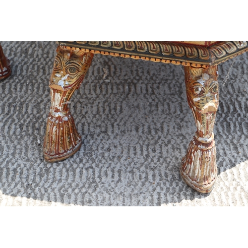 774 - A Kashmiri low prayer table, the octagonal top on eight hoof support legs, 67cms wide.