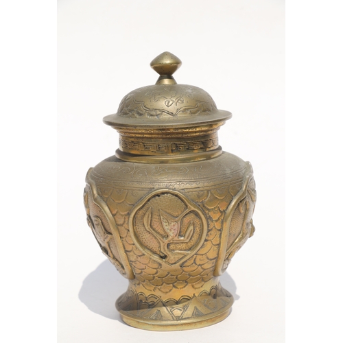 693 - A Chinese polished bronze / brass two-handled censer with six character mark to the underside, 11cms... 