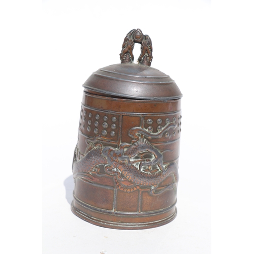 693 - A Chinese polished bronze / brass two-handled censer with six character mark to the underside, 11cms... 