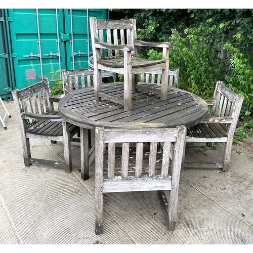 2 - A set of six well weathered  Iroko wood garden armchairs with slatted backs and seats; and a large m... 