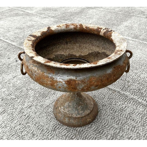 10 - A cast iron classical form pedestal urn planter with ring handles. 54cm wide