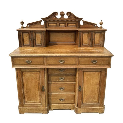 1001 - A 19th century Aesthetic period pitch pine and burr wood sideboard, the super-structure with two cup... 