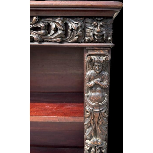 1007 - A pair of Victorian mahogany open bookcases, the frieze and sides decorated with applied carved oak ... 