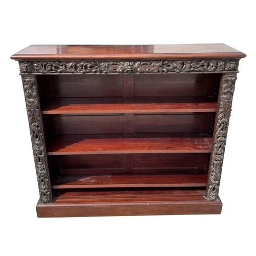 1007 - A pair of Victorian mahogany open bookcases, the frieze and sides decorated with applied carved oak ... 