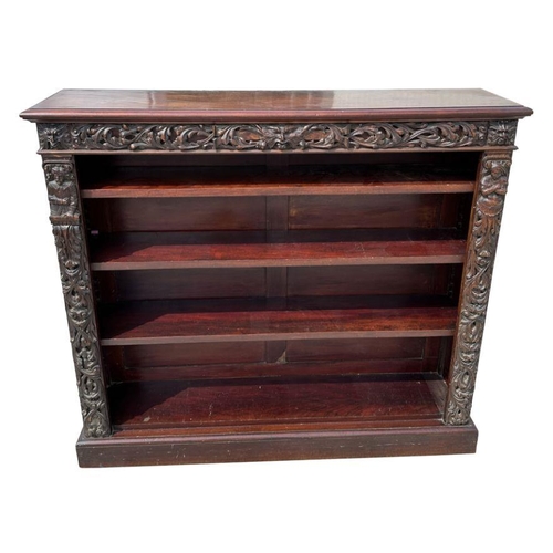 1007 - A pair of Victorian mahogany open bookcases, the frieze and sides decorated with applied carved oak ... 