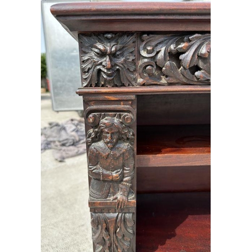 1007 - A pair of Victorian mahogany open bookcases, the frieze and sides decorated with applied carved oak ... 