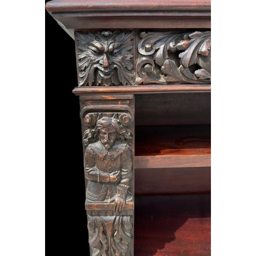 1007 - A pair of Victorian mahogany open bookcases, the frieze and sides decorated with applied carved oak ... 