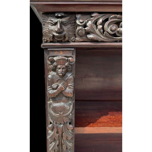 1007 - A pair of Victorian mahogany open bookcases, the frieze and sides decorated with applied carved oak ... 