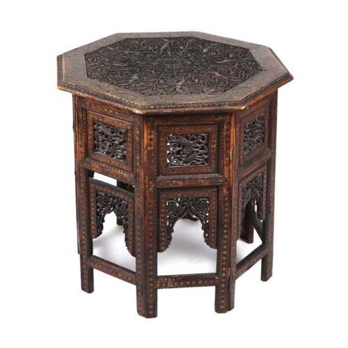 1013 - A Moroccan Moorish octagonal occasional table with brass inlaid decoration, 59cm wide.