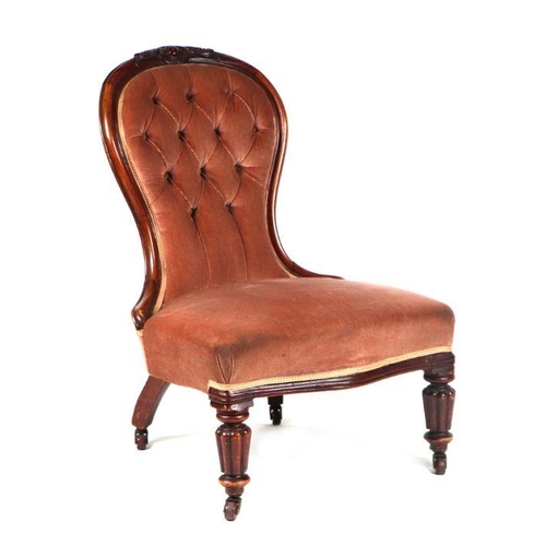 1014 - A Victorian walnut upholstered buttoned back nursing chair with serpentine front seat and turned &am... 