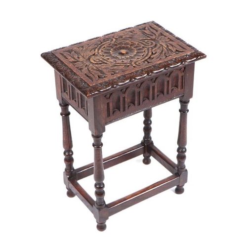 1016 - A 17th century style carved oak box stool, 36cm wide.