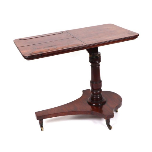 1019 - A William IV mahogany reading / writing library table, the rounded rectangular top with two adjustab... 