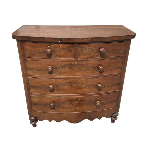 1022 - A Victorian figured mahogany bowfront chest of two short and three graduated long drawers, on turned... 