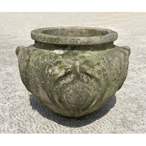 11 - A reconstituted stone planter decorated with roundels, 36cm diameter.