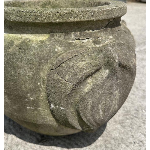 11 - A reconstituted stone planter decorated with roundels, 36cm diameter.