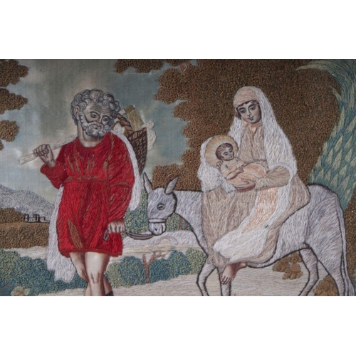 118 - An 18th / 19th century woolwork depicting Mary and Joseph with the Baby Jesus, framed & glazed, ... 