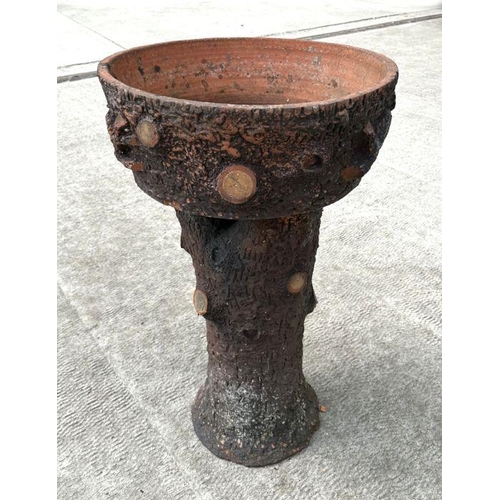 13 - A large terracotta planter in the form of a tree stump, 94cm high, 56cm diameter