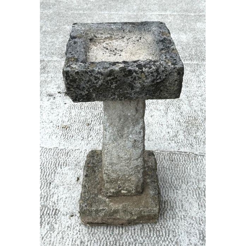 14 - A well weathered carved stone bird bath with square top, on a tapering square column, 64cm high, 32c... 