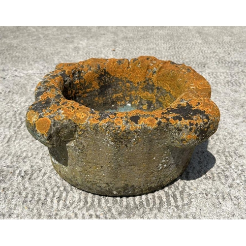 15 - A  well weathered reconstituted stone mortar, 40cm diameter.