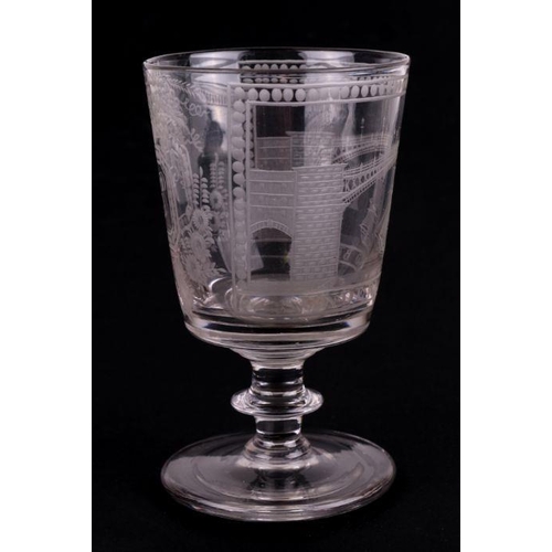 291 - An early 19th century Sunderland Bridge glass rummer, the bucket shaped bowl engraved with the title... 