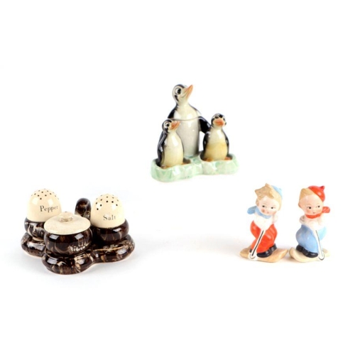 312 - A large collection of novelty cruet sets including Goebel Skiers, Macintyre, Carltonware and others ... 