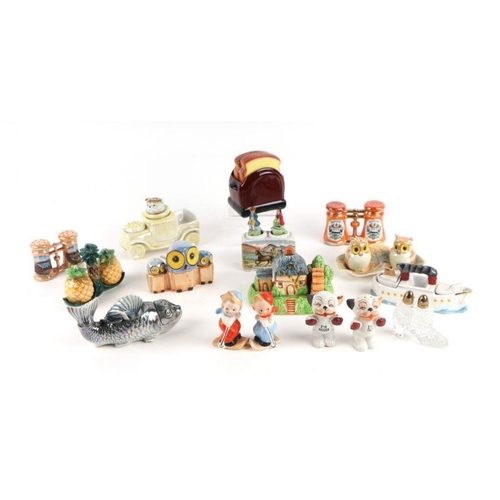 312 - A large collection of novelty cruet sets including Goebel Skiers, Macintyre, Carltonware and others ... 