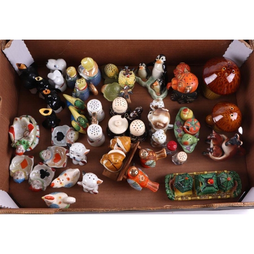 312 - A large collection of novelty cruet sets including Goebel Skiers, Macintyre, Carltonware and others ... 