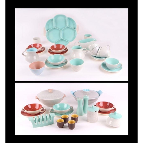 313 - A quantity of assorted Poole Twin Tone pottery tablewares including plates, cups, jugs, hors d'oeuvr... 