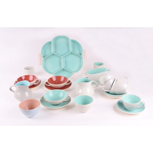 313 - A quantity of assorted Poole Twin Tone pottery tablewares including plates, cups, jugs, hors d'oeuvr... 