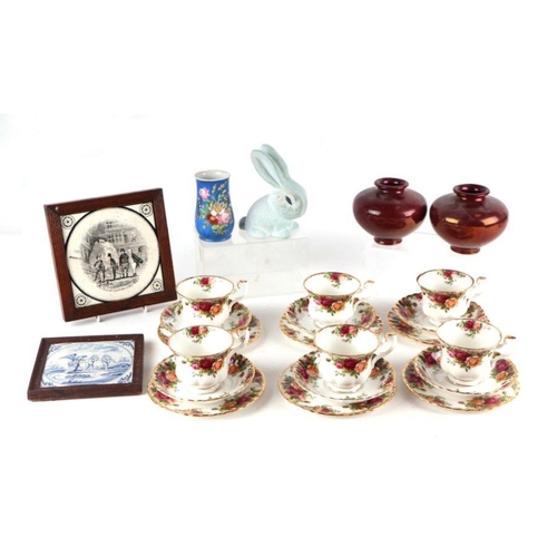 323 - A Royal Albert Old Country Roses pattern part tea set; together with two framed tiles; miniature jug... 