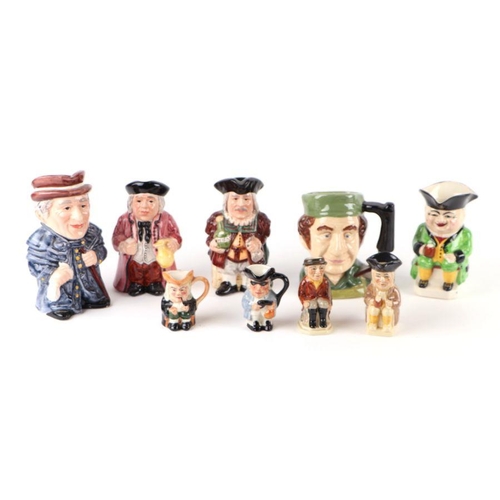 324 - A large quantity of character jugs to include Royal Doulton Drummer Boy and The Golfer.