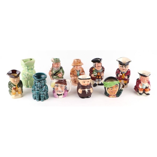 324 - A large quantity of character jugs to include Royal Doulton Drummer Boy and The Golfer.