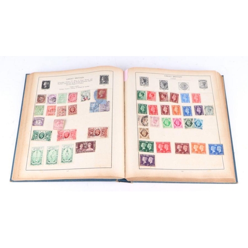 34 - A Strand stamp album containing World and GB stamps including Penny Reds, Canadian, India, Japan, US... 