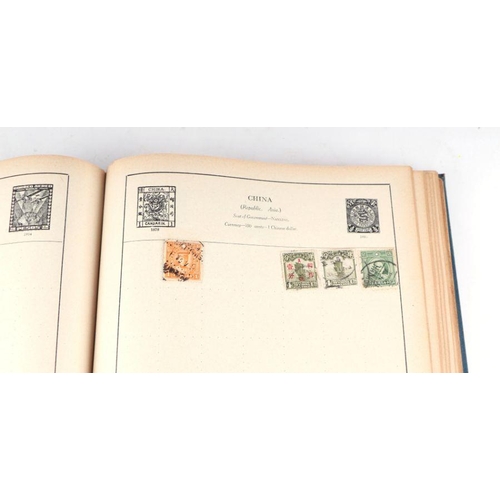 34 - A Strand stamp album containing World and GB stamps including Penny Reds, Canadian, India, Japan, US... 