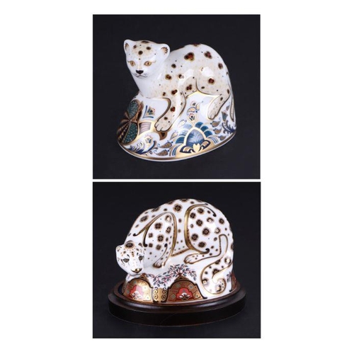 457 - Two Royal Crown Derby paperweights, Snow Leopard, special limited edition 230/250, on a wooden plint... 