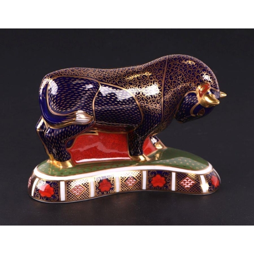 469 - A Royal Crown Derby paperweight, Bull, with gold stopper and boxed.