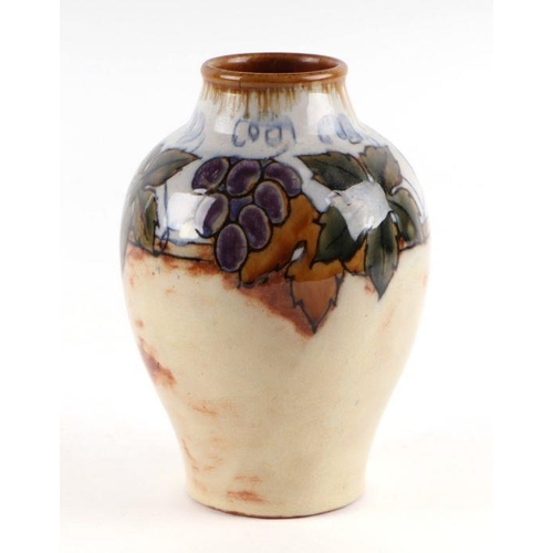 500 - A Royal Doulton Lambeth vase decorated with grape and vine, 21cm high.