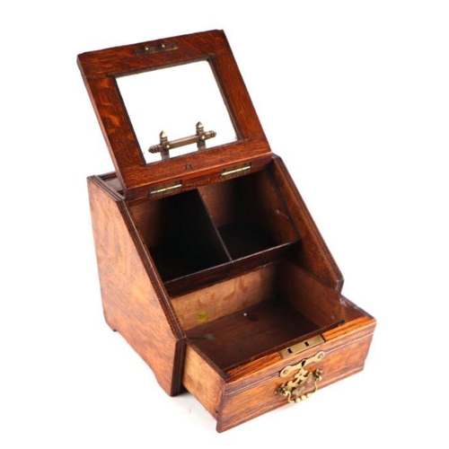 507 - A late Victorian oak novelty stationary box in the form of a coal scuttle having a glazed door openi... 