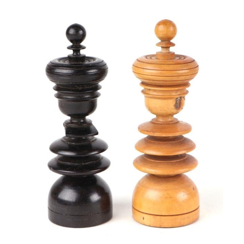 522 - A large boxwood and ebonised chess set; together with a matching set of draughts.