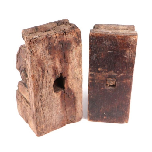 533 - A pair of hardwood Indo-Persian bookends fashioned from pillar capitals, each 25cm high (2)