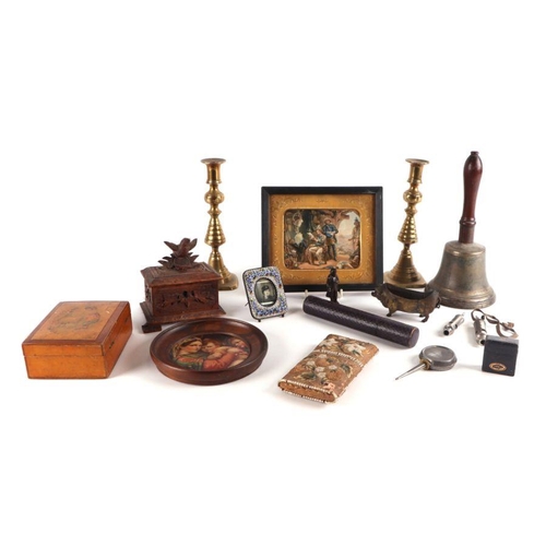 569 - A bronze hand bell; together with a Black Forest style jewellery box; a pair of brass candlesticks; ... 