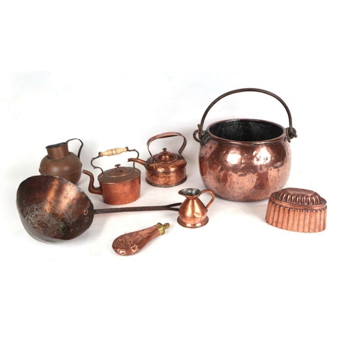 573 - Three boxes of assorted copper and metal wares including a copper cauldron, brass fire irons, a copp... 