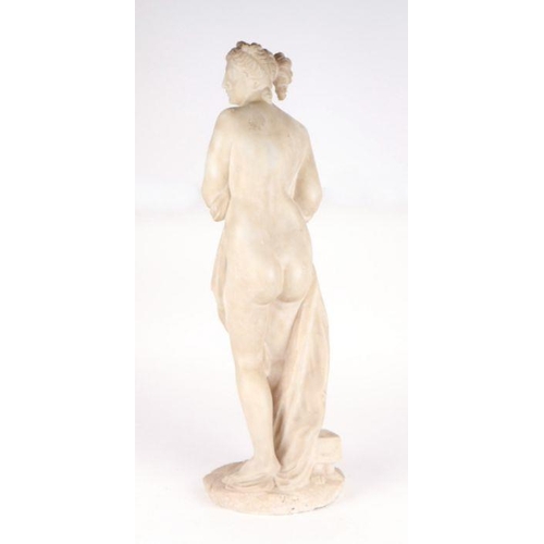 587 - After the Antique - a marble statue depicting a classical Roman lady wearing a draped scrolling robe... 