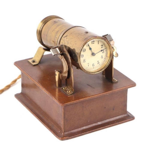 634 - An early 20th century Eveready light projector or brothel clock, the lacquered brass body housing a ... 