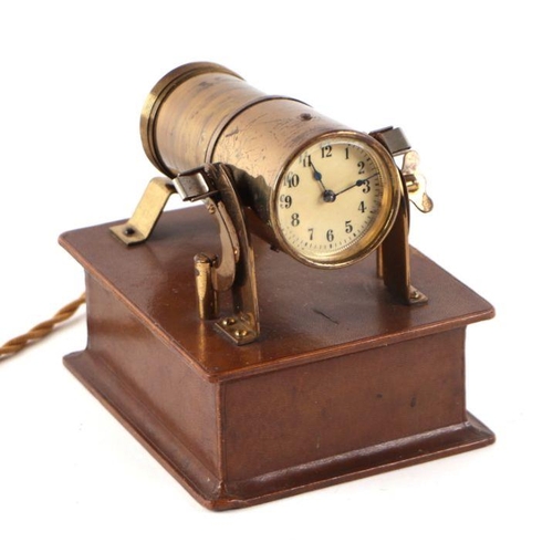 634 - An early 20th century Eveready light projector or brothel clock, the lacquered brass body housing a ... 