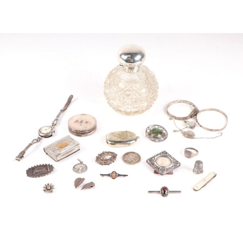 652 - A silver topped cut glass scent bottle; together with a silver vesta case; a Marsh Arab ware compact... 