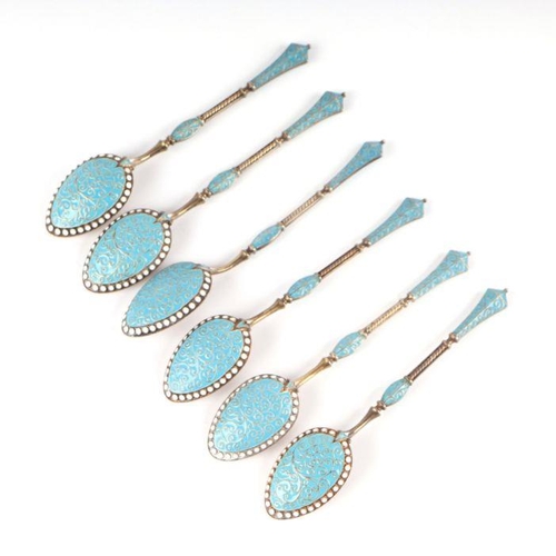 688 - A set of six continental silver gilt and enamel teaspoons, 75g (6).